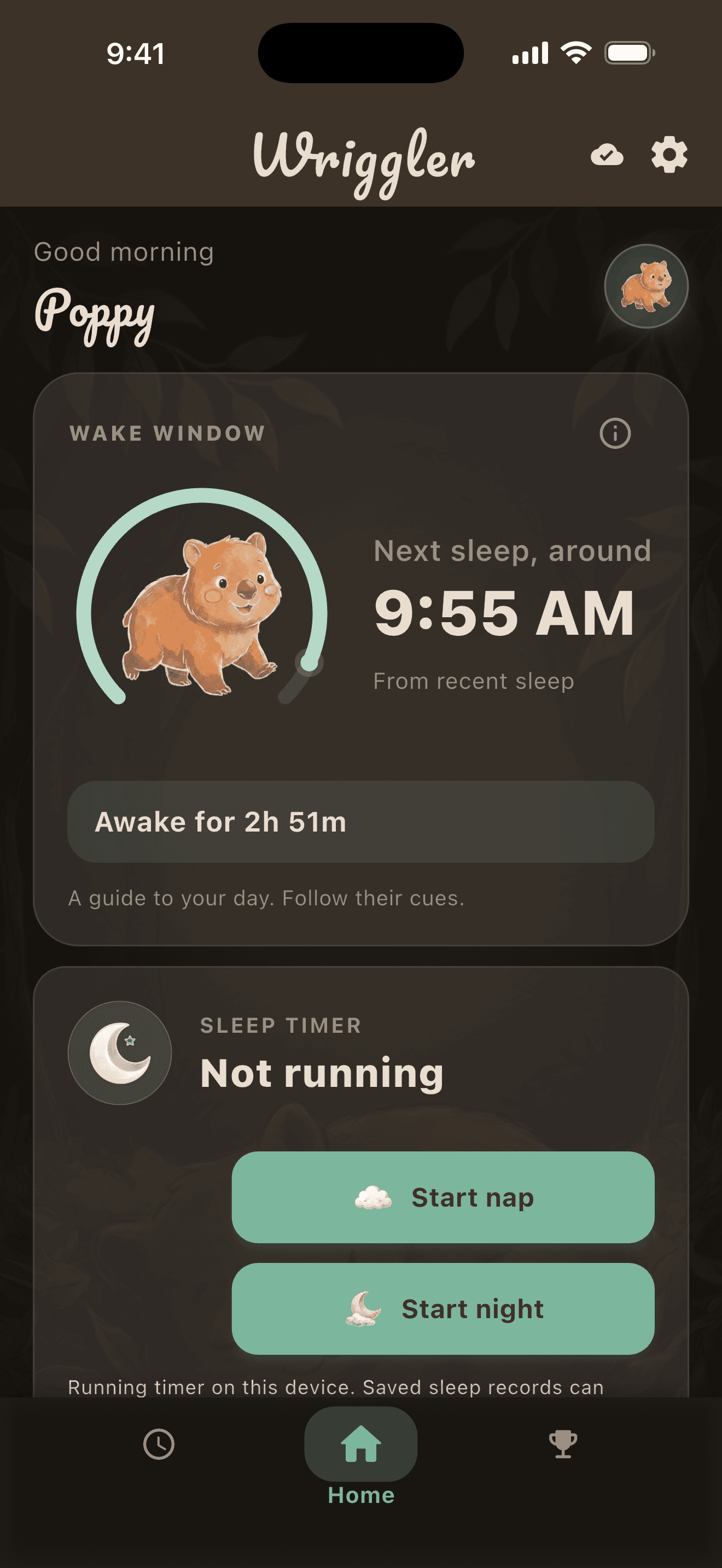 The Wriggler home screen in warm dark mode: a personal wake estimate, time awake and the next sleep time, above the sleep timer and start controls.